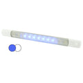 Hella Marine surface strip light with white and blue LEDs and integrated waterproof switch mounted on a boat interior panel